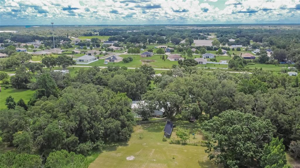 3102 East Trapnell Road Plant City, FL 33566 - Photo 46 of 100 an aerial view of residential houses with outdoor space and trees