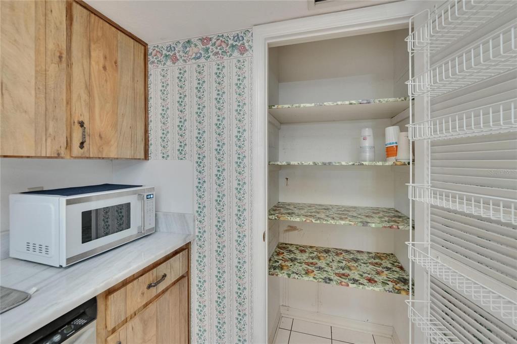 3102 East Trapnell Road Plant City, FL 33566 - Photo 65 of 100 a kitchen with a stove and a microwave
