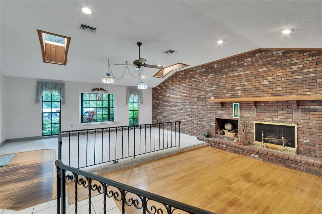 3102 East Trapnell Road Plant City, FL 33566 - Photo 69 of 100 a view of an empty room with exposed radiator and fireplace