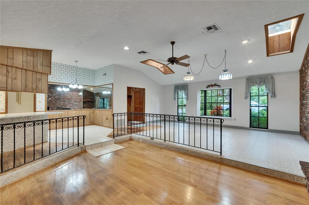 3102 East Trapnell Road Plant City, FL 33566 - Photo 72 of 100 a view of a hall with a floor to ceiling window and stairs
