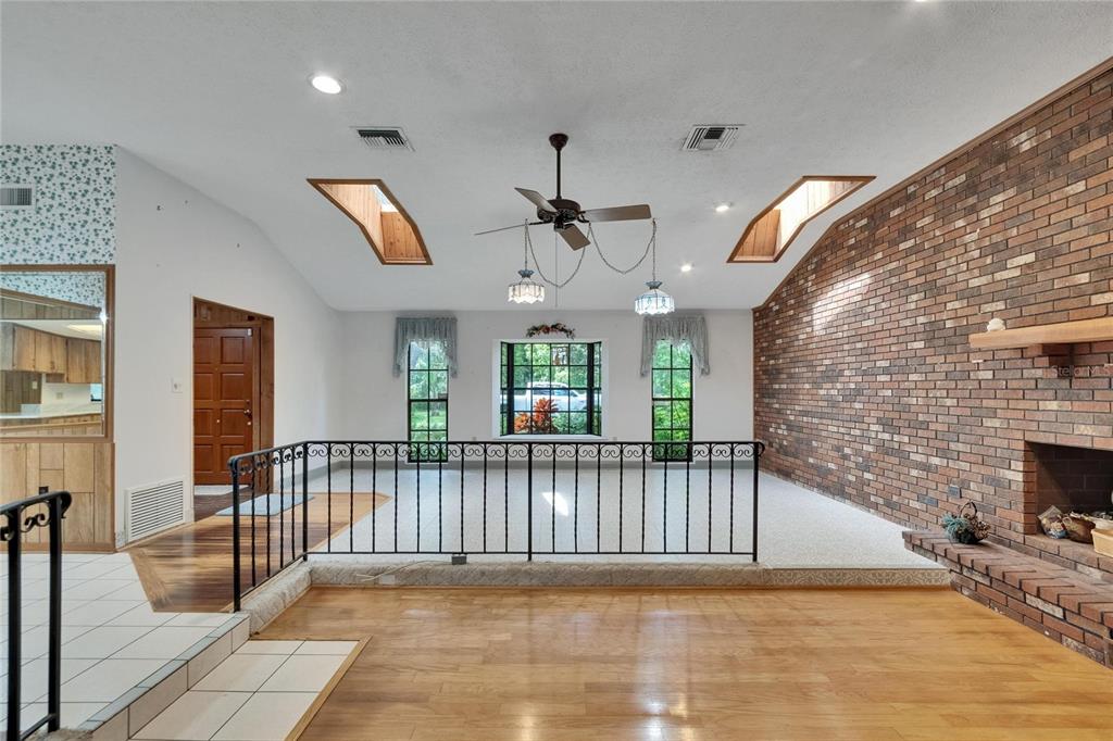 3102 East Trapnell Road Plant City, FL 33566 - Photo 73 of 100 an empty room with wooden floor and windows