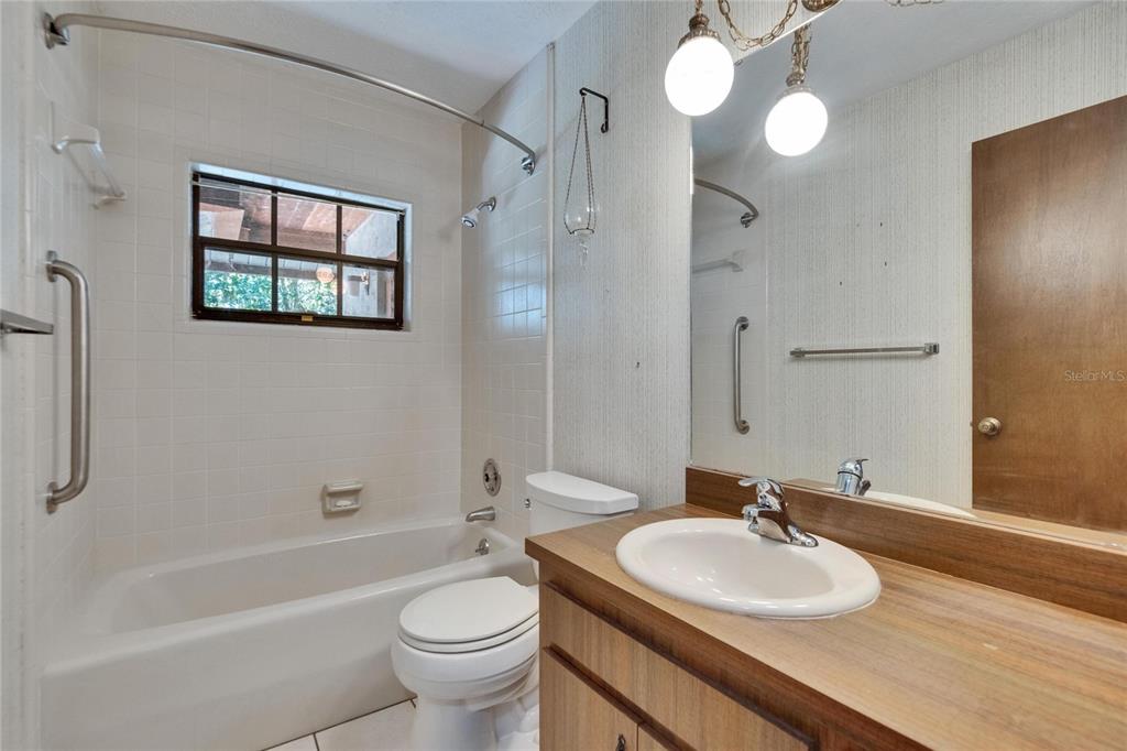 3102 East Trapnell Road Plant City, FL 33566 - Photo 81 of 100 a bathroom with a sink a toilet and shower