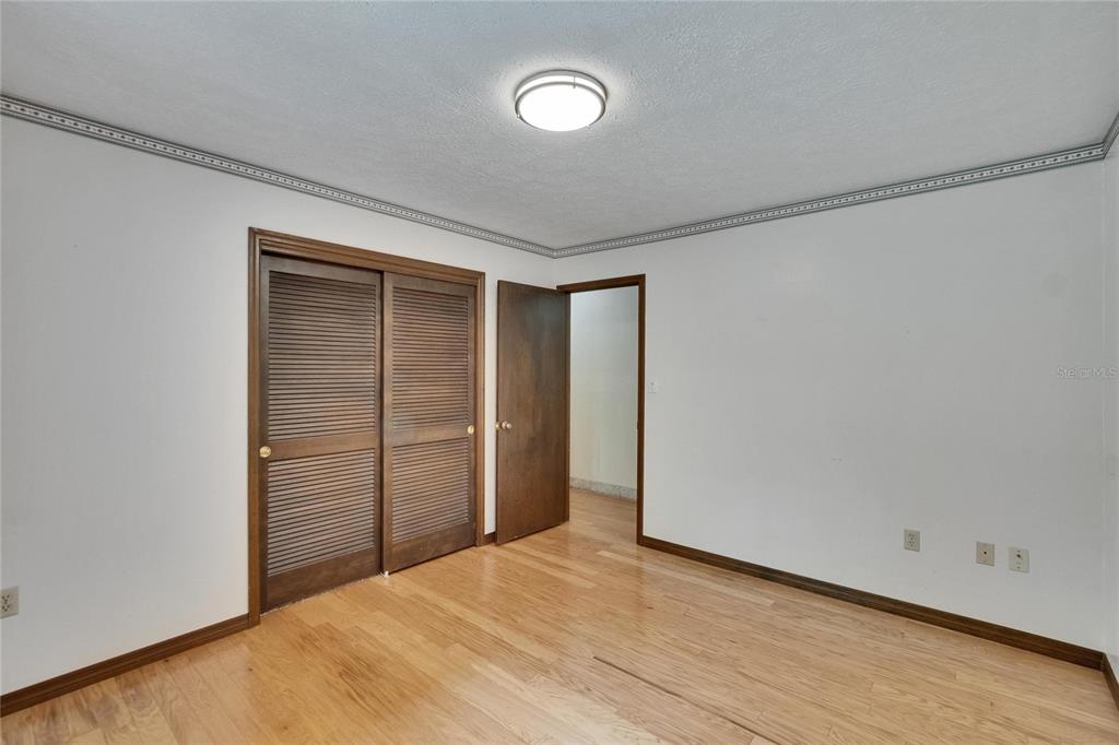 3102 East Trapnell Road Plant City, FL 33566 - Photo 85 of 100 a view of empty room with wooden floor