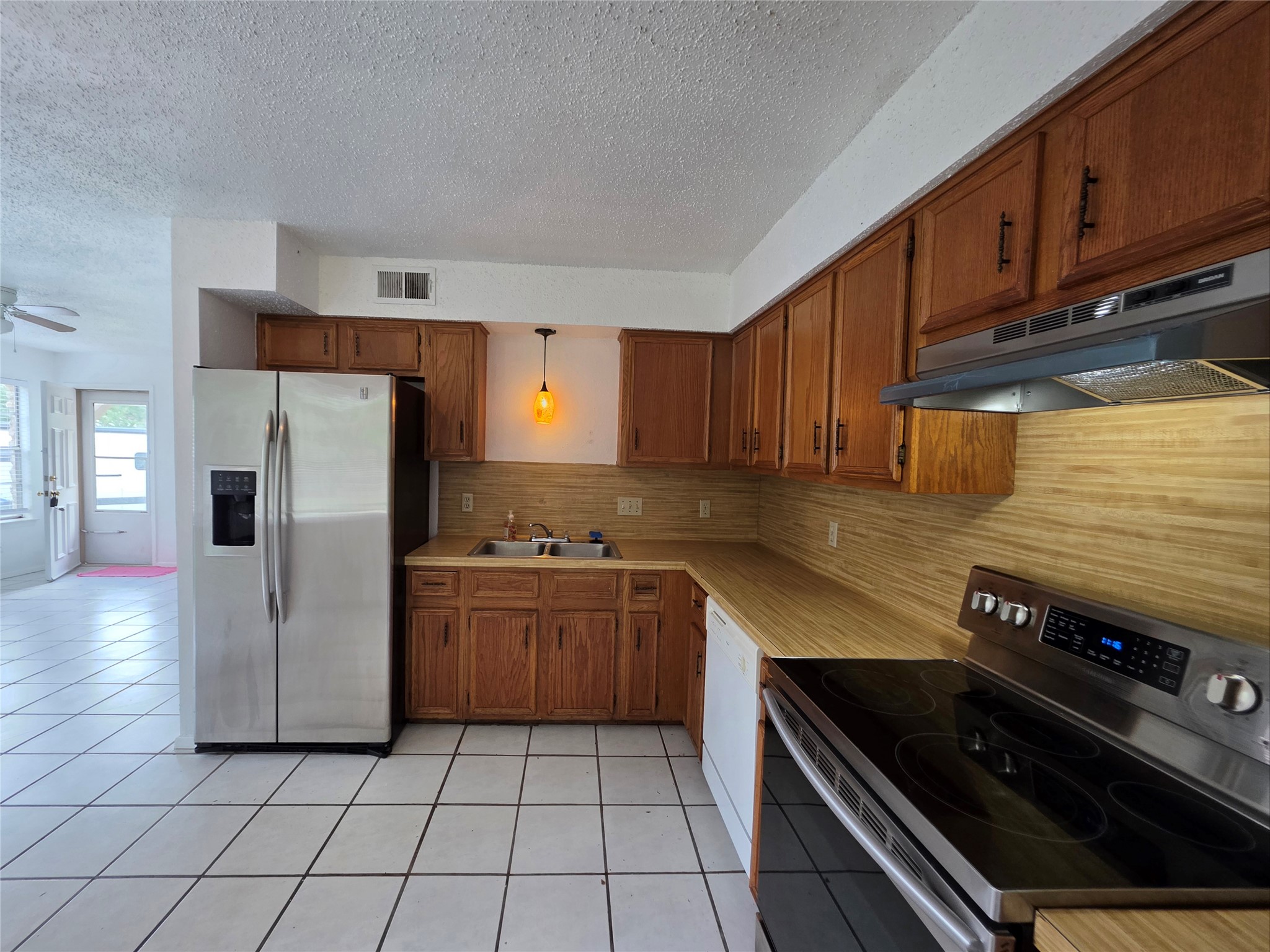 8818 Clearbrook Trail Austin, TX 78729 - Photo 8 of 22 Unit A kitchen comes with brand new vent hood