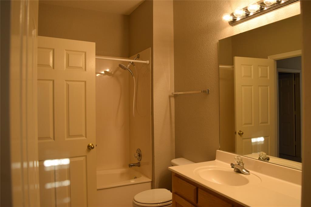 27101 Meadowmore Court Whitney, TX 76692 - Photo 19 of 31 a bathroom with a sink and a mirror