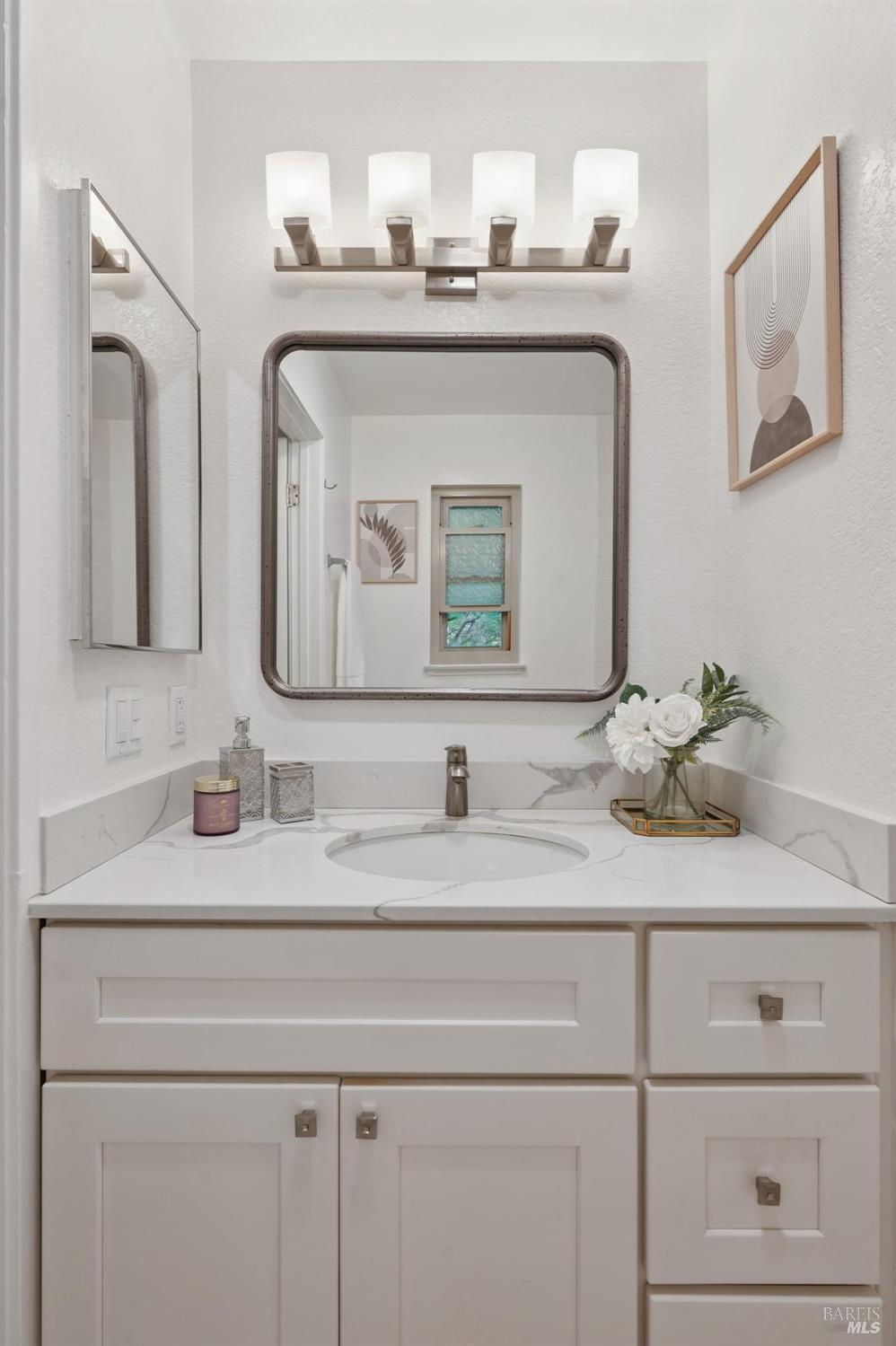 211 Danielle Way San Rafael, CA 94903 - Photo 16 of 33 a bathroom with double vanity sinks and a mirror