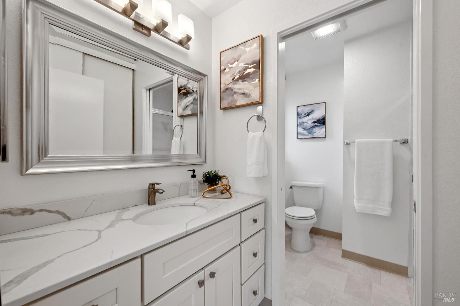 211 Danielle Way San Rafael, CA 94903 - Photo 21 of 33 a bathroom with a sink a toilet and shower curtain