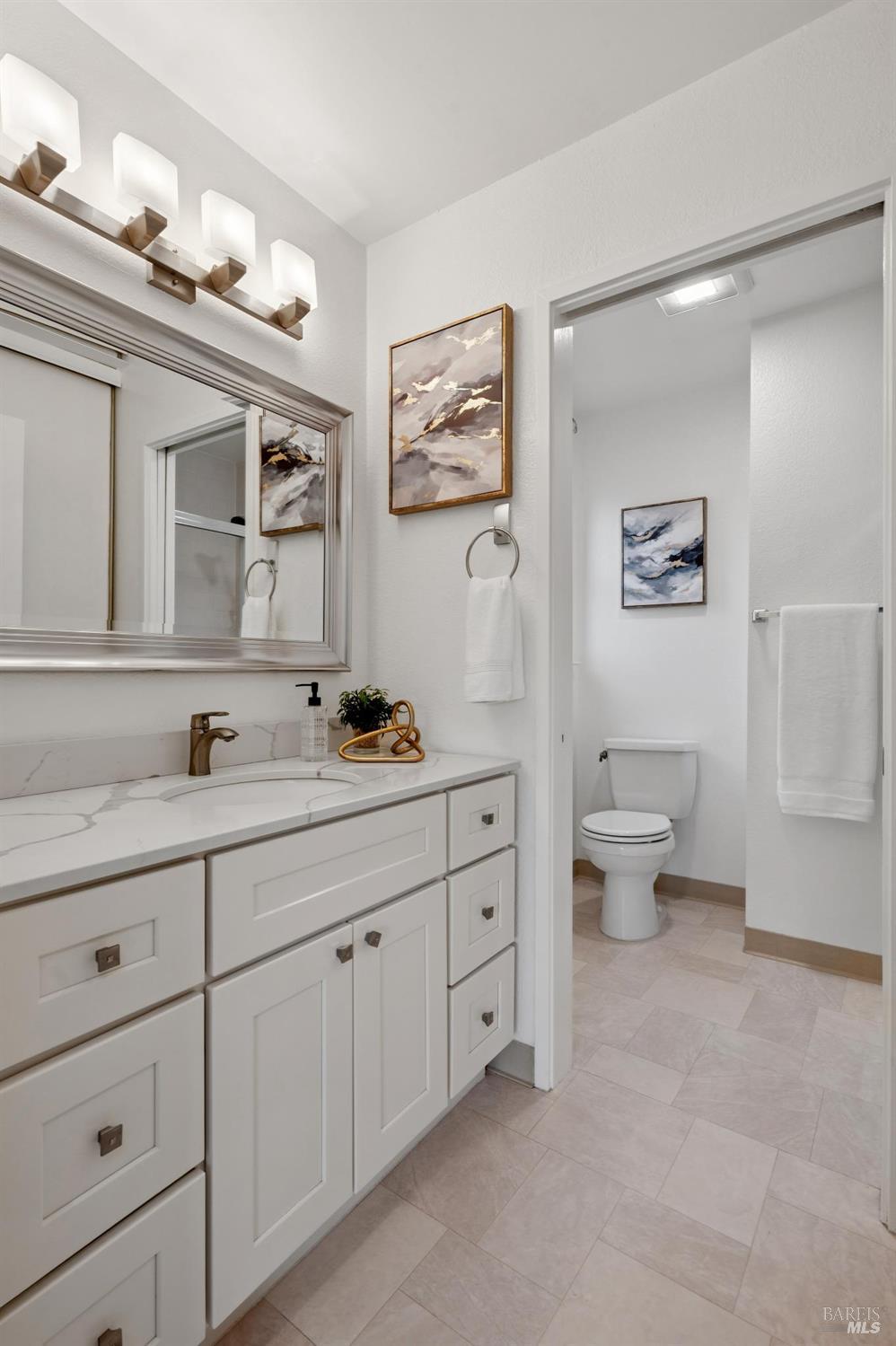 211 Danielle Way San Rafael, CA 94903 - Photo 22 of 33 a spacious bathroom with a double vanity sink a toilet and a mirror