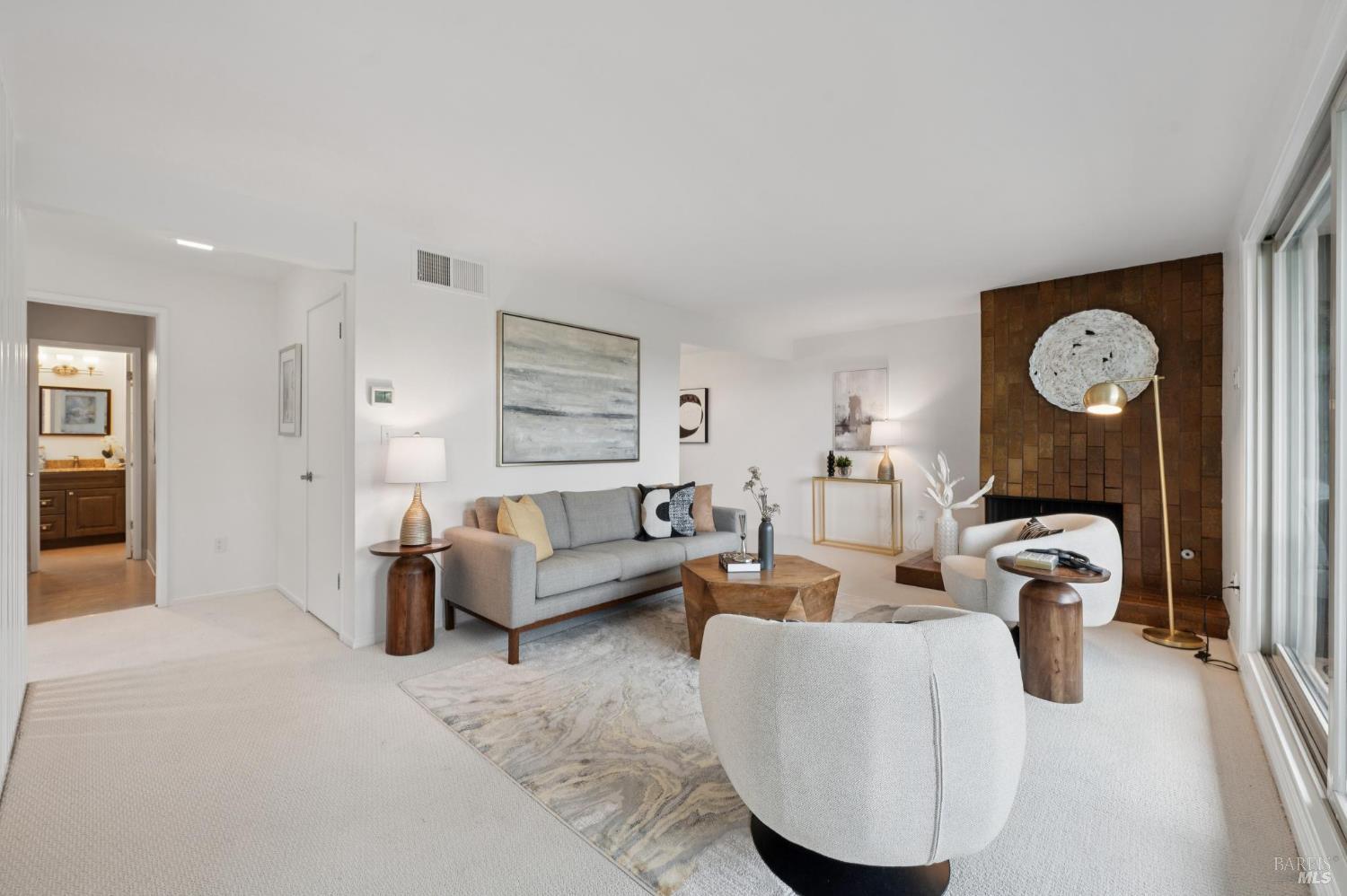211 Danielle Way San Rafael, CA 94903 - Photo 3 of 33 a living room with furniture a clock and a window
