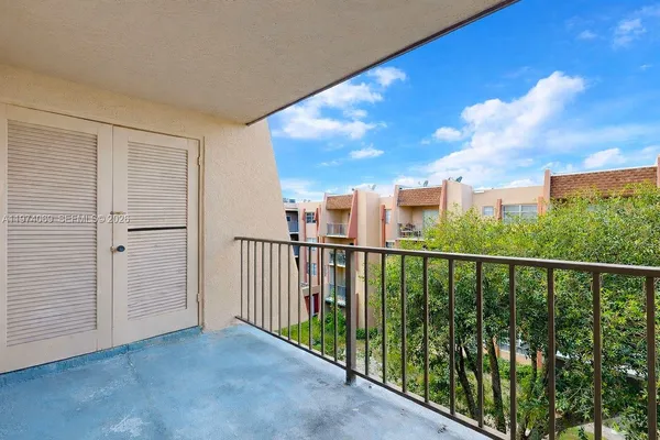a balcony with furniture and city view