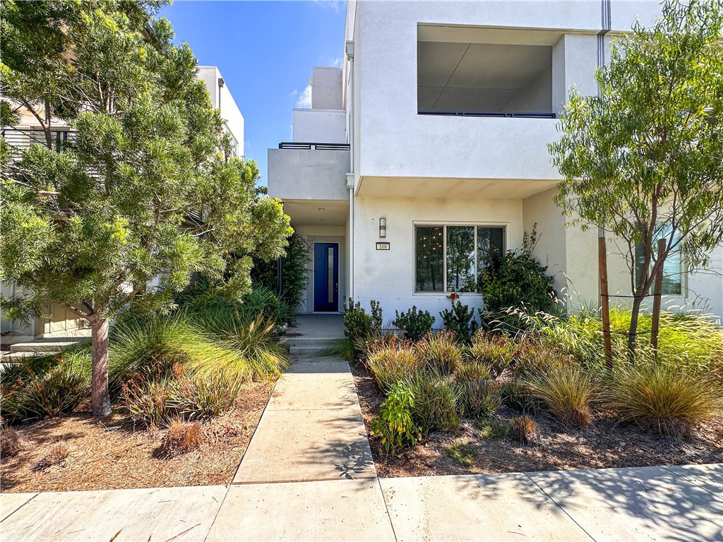168 Spectacle Irvine, CA 92618 - Photo 2 of 42 a front view of a house with garden