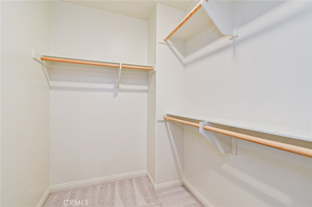 168 Spectacle Irvine, CA 92618 - Photo 24 of 42 a view of walk in closet with empty racks