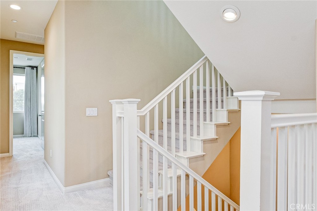 168 Spectacle Irvine, CA 92618 - Photo 26 of 42 a view of staircase with railing and white walls