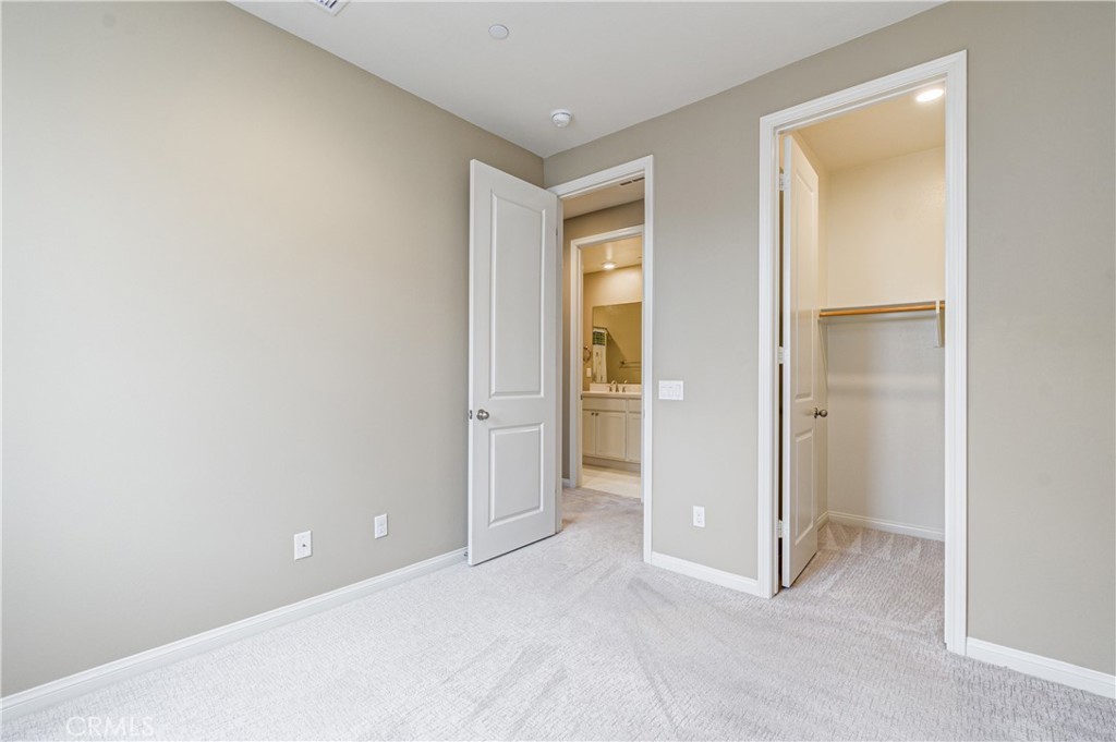 168 Spectacle Irvine, CA 92618 - Photo 28 of 42 an empty room with closet and a bathroom