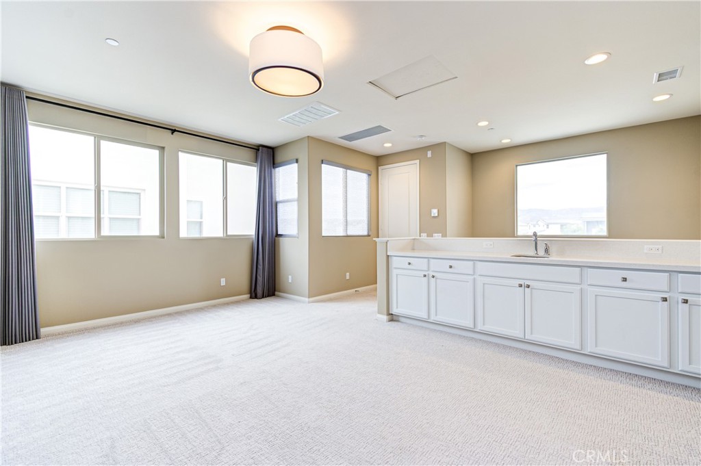 168 Spectacle Irvine, CA 92618 - Photo 34 of 42 a view of an empty room with window and cabinet