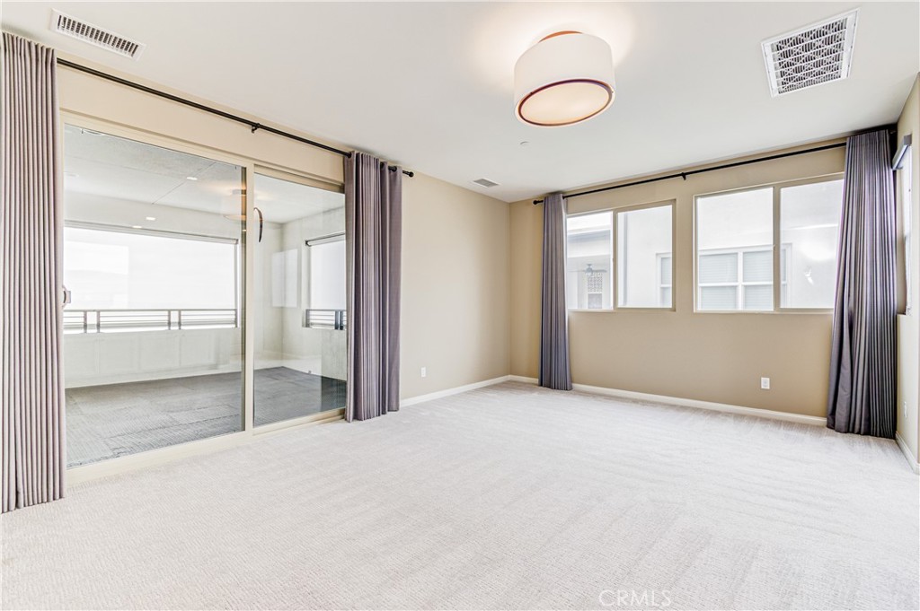 168 Spectacle Irvine, CA 92618 - Photo 35 of 42 a view of an empty room with glass door