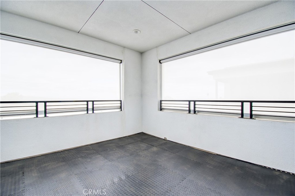 168 Spectacle Irvine, CA 92618 - Photo 36 of 42 a view of a hallway with an empty room