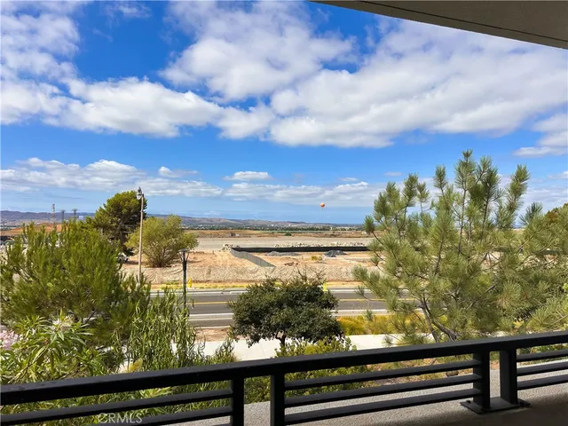 a view of a room with a ceiling fan