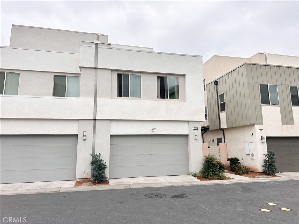 168 Spectacle Irvine, CA 92618 - Photo 41 of 42 a front view of a house with garage