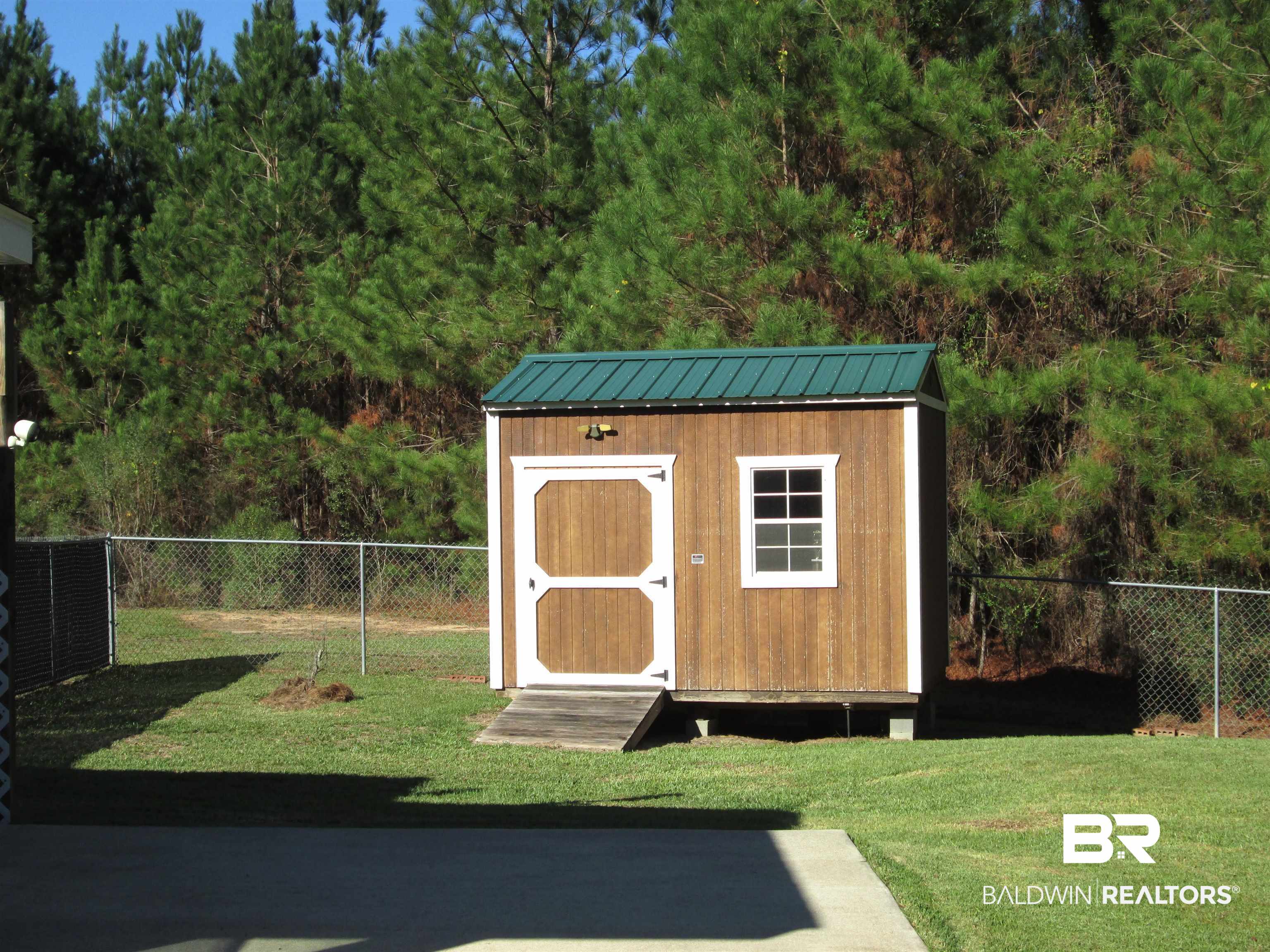 530 Brethren Church Road Fruitdale, AL 36539 - Photo 15 of 24 View of outbuilding featuring a lawn