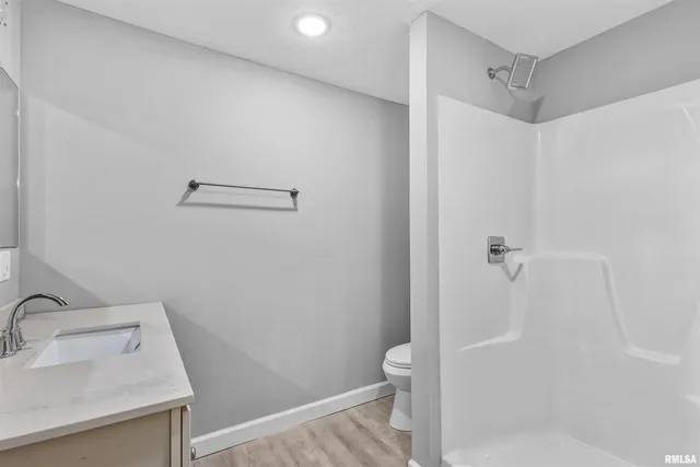 a bathroom with a sink and toilet