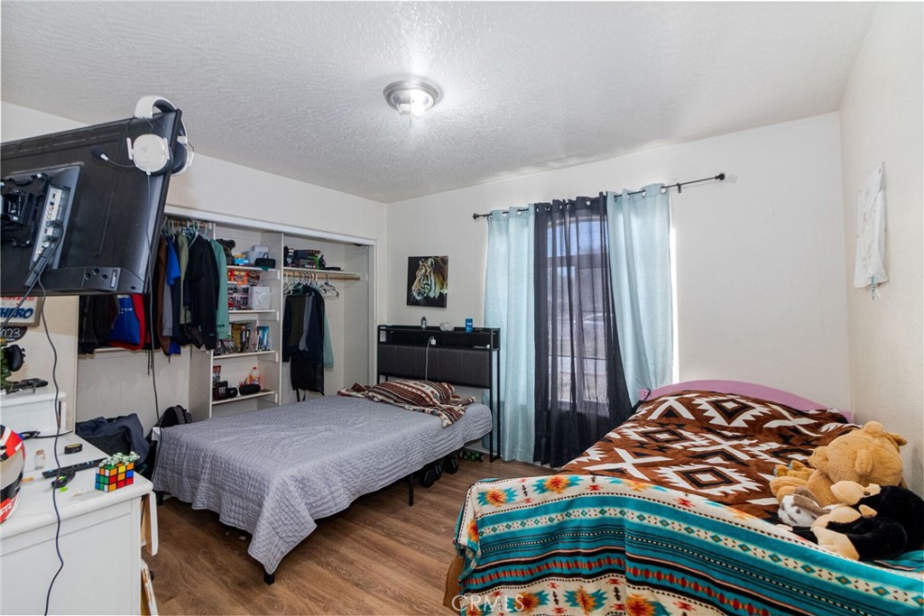 18936 Rock Springs Road Hesperia, CA 92345 - Photo 14 of 28 a bedroom with bed and a window