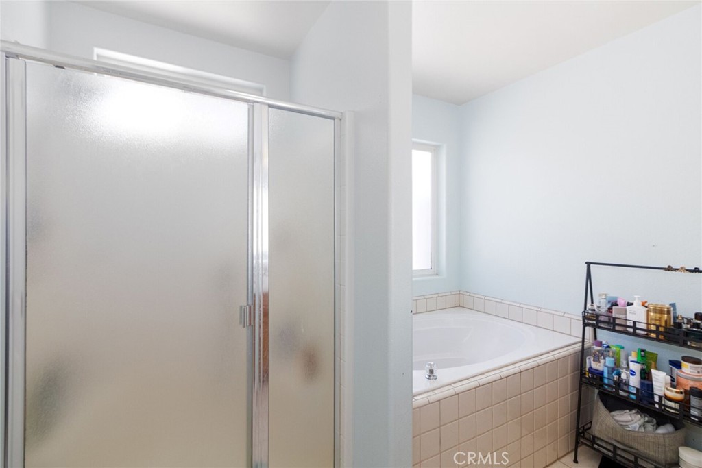 18936 Rock Springs Road Hesperia, CA 92345 - Photo 19 of 28 a bathroom with a tub and shower