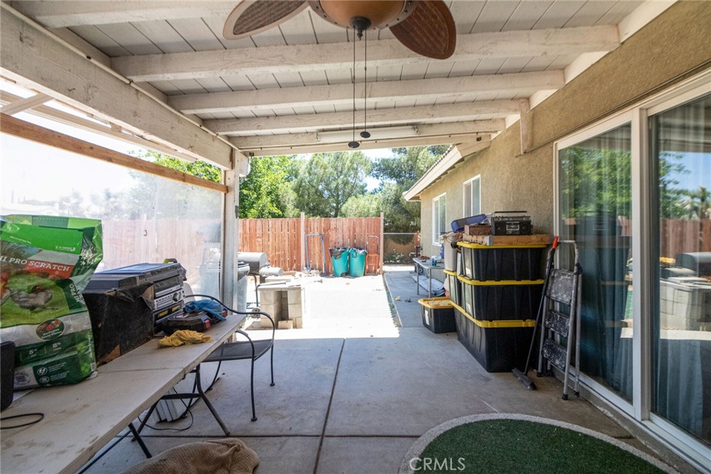 18936 Rock Springs Road Hesperia, CA 92345 - Photo 22 of 28 a room with patio furniture and a grill