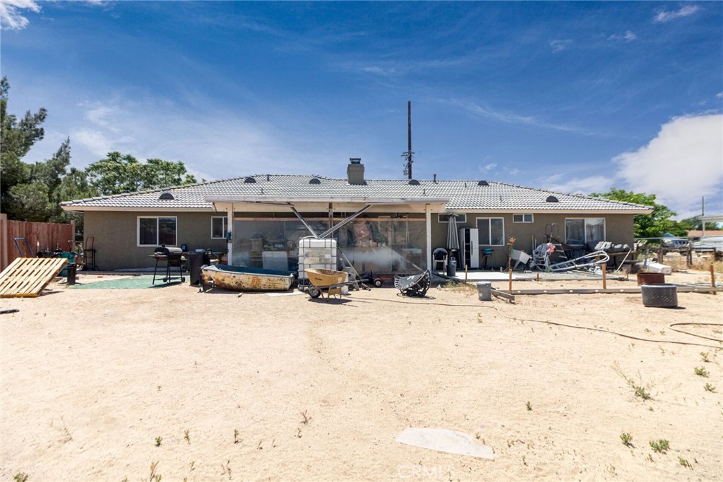 18936 Rock Springs Road Hesperia, CA 92345 - Photo 23 of 28 a view of a house with snow on the road