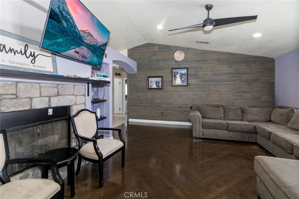18936 Rock Springs Road Hesperia, CA 92345 - Photo 5 of 28 a living room with a couch and a ceiling fan