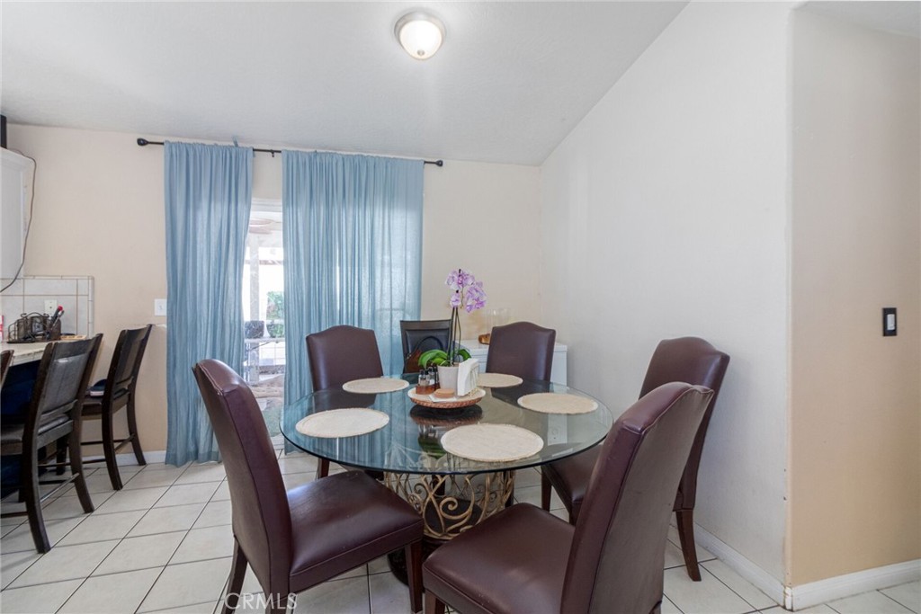 18936 Rock Springs Road Hesperia, CA 92345 - Photo 8 of 28 a view of a dining room with furniture and window