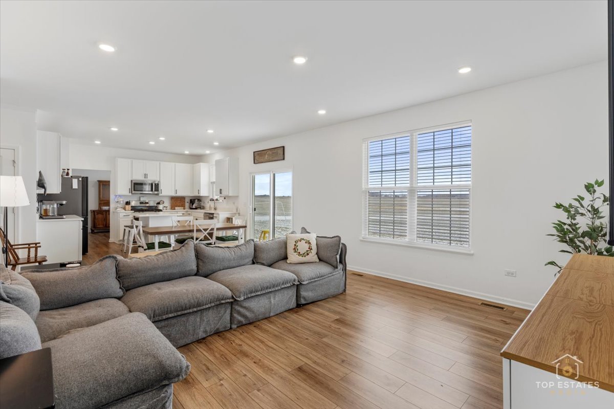 1457 Collins Street Elburn, IL 60119 - Photo 21 of 39 a living room with furniture and a large window