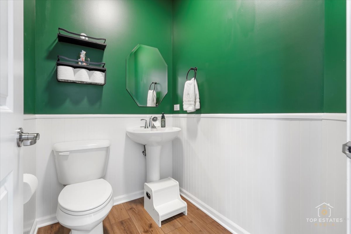 1457 Collins Street Elburn, IL 60119 - Photo 24 of 39 a bathroom with a toilet sink and mirror