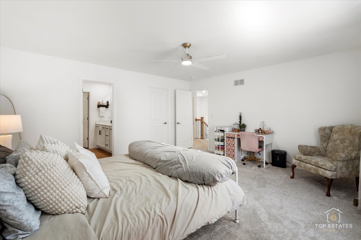 1457 Collins Street Elburn, IL 60119 - Photo 28 of 39 a bedroom with a bed furniture and a couch