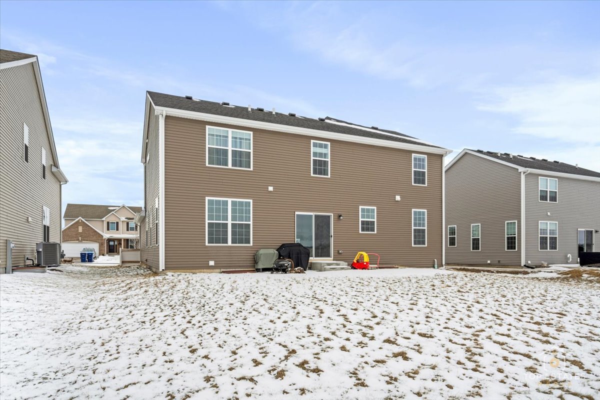 1457 Collins Street Elburn, IL 60119 - Photo 36 of 39 a front view of a house with a yard