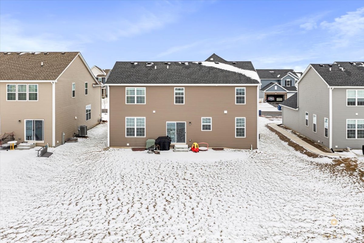 1457 Collins Street Elburn, IL 60119 - Photo 37 of 39 a front view of a house with a yard