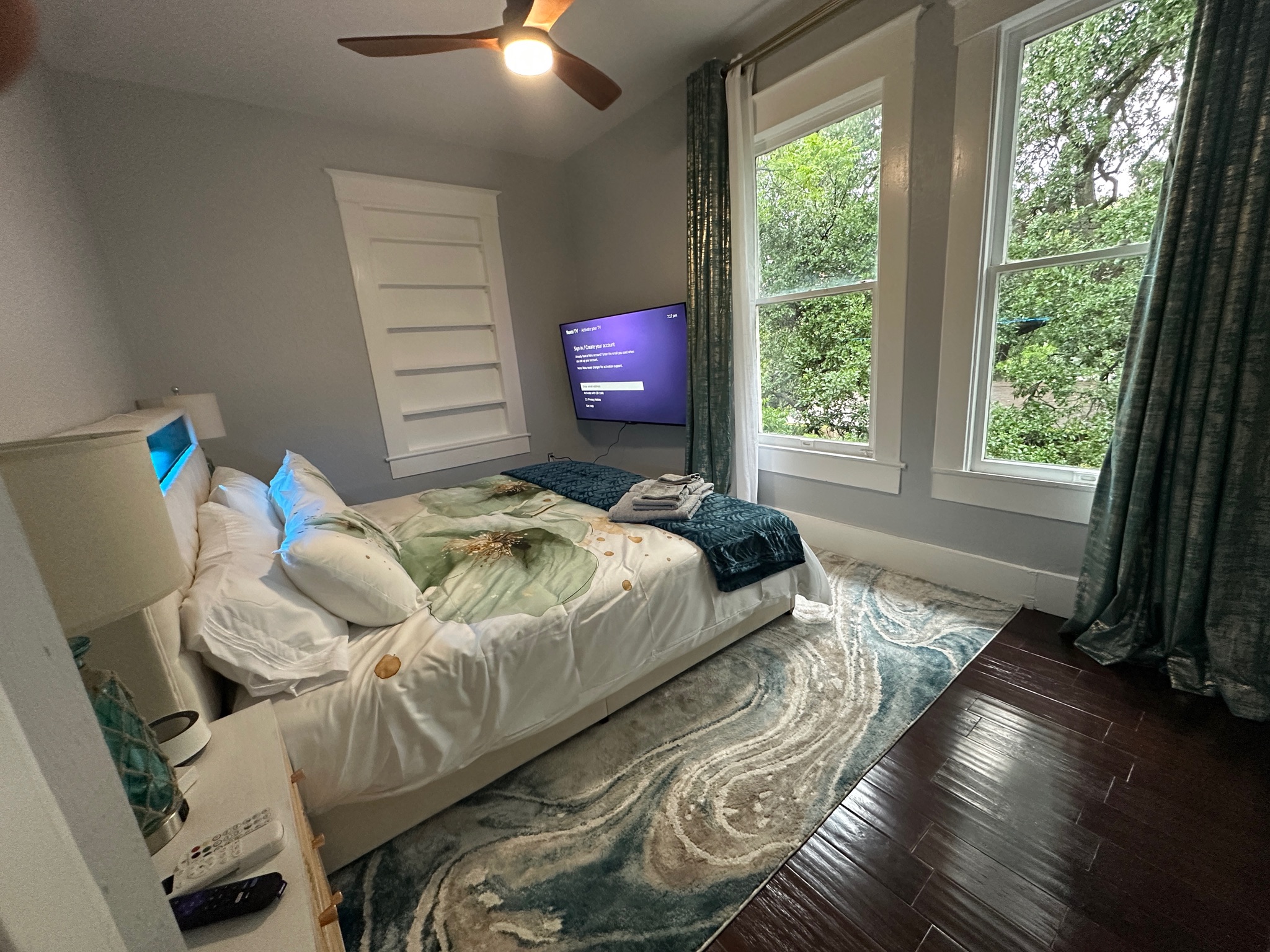 3210 Hampton Road, Unit A B C Austin, TX 78705 - Photo 5 of 42 Bedroom featuring wood finished floors, multiple windows, and ceiling fan