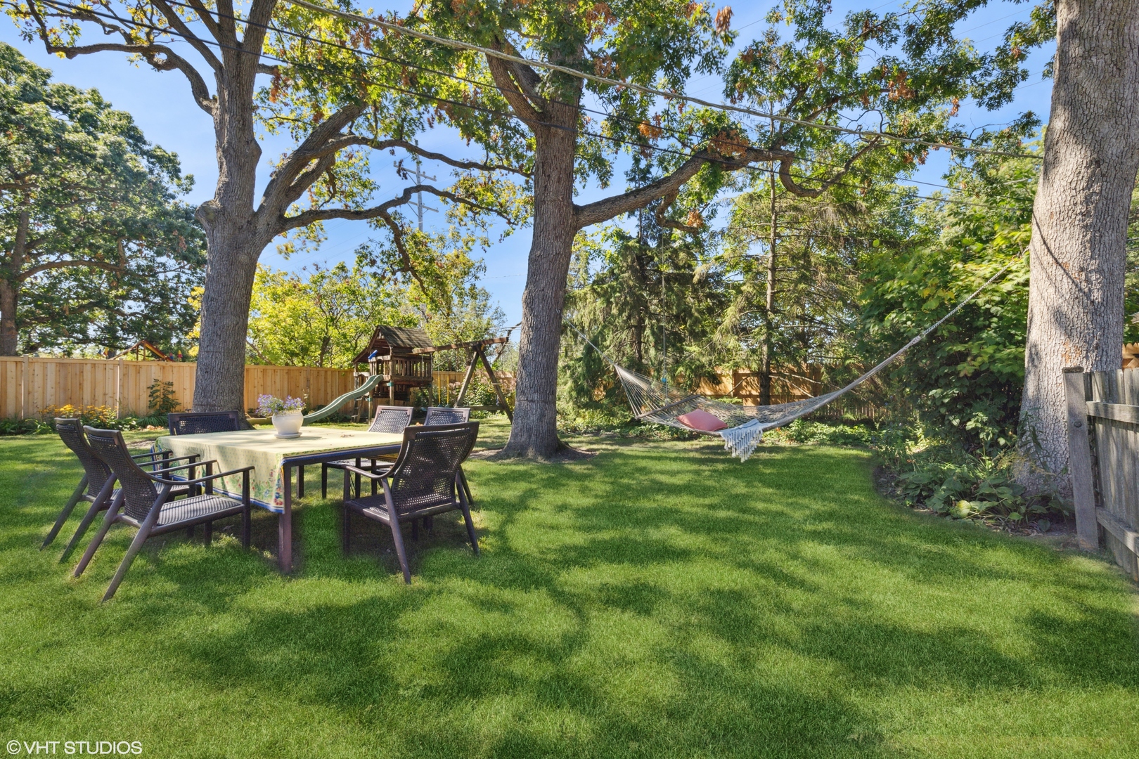 650 Garfield Avenue Lake Bluff, IL 60044 - Photo 19 of 25 a view of a wooden bench sitting in the garden