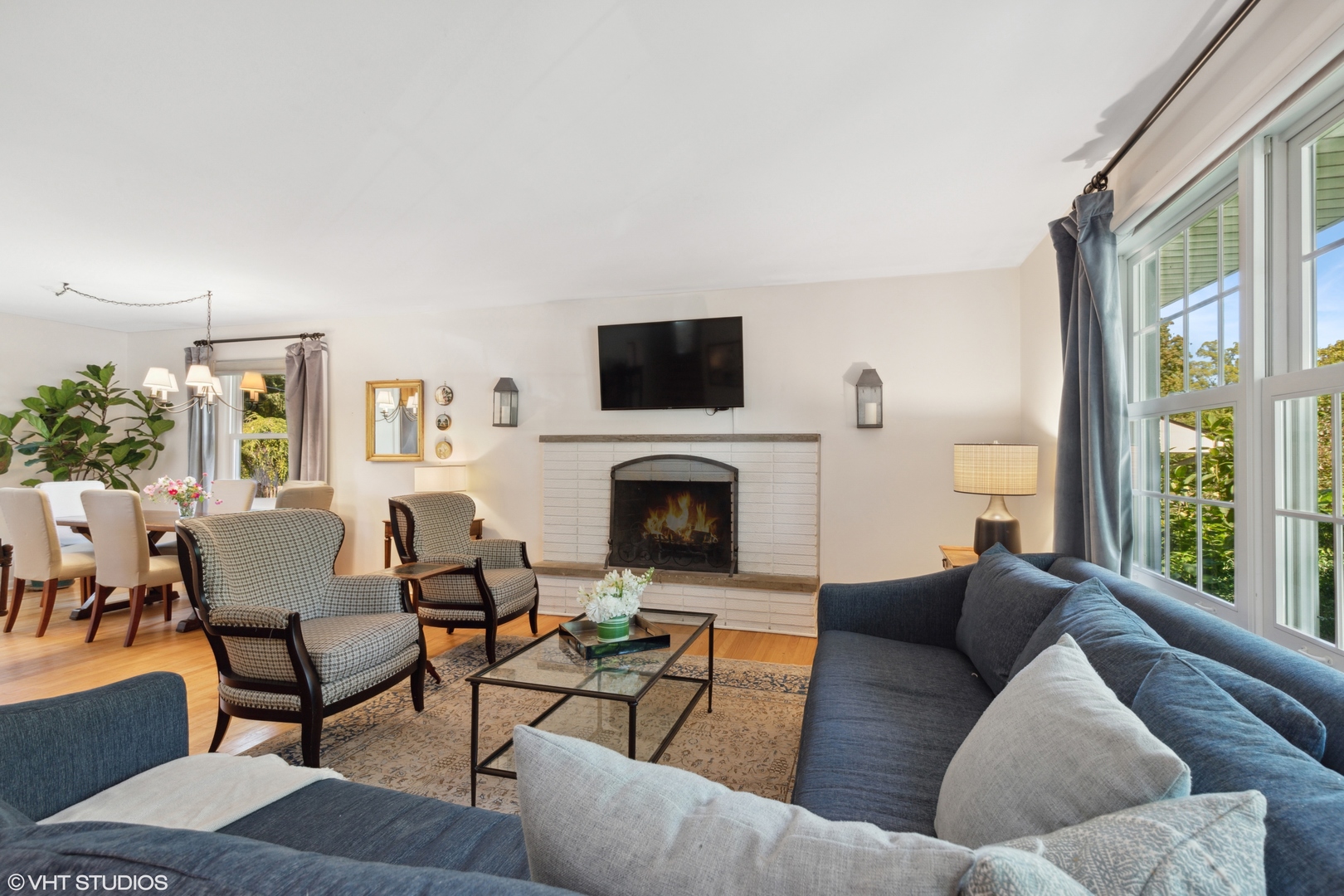 650 Garfield Avenue Lake Bluff, IL 60044 - Photo 3 of 25 a living room with furniture a flat screen tv and a fireplace