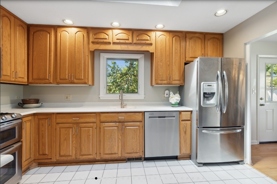 650 Garfield Avenue Lake Bluff, IL 60044 - Photo 8 of 25 a kitchen with stainless steel appliances granite countertop a refrigerator sink and cabinets