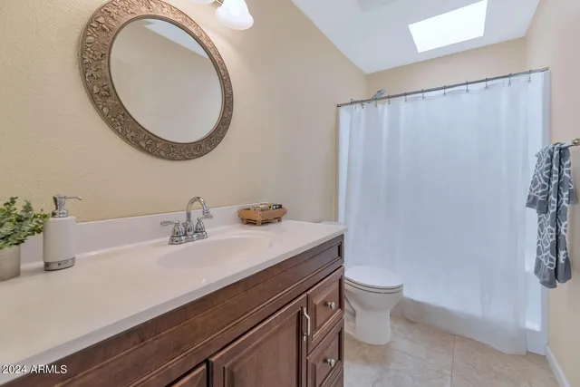 an empty room with closet and windows