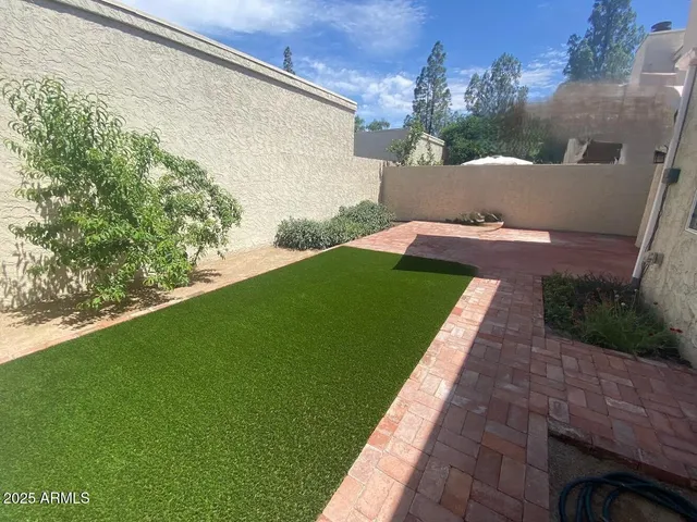 a view of front door of house with yard