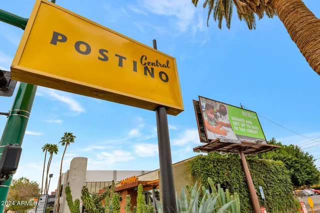 a view of outdoor area with table and chairs