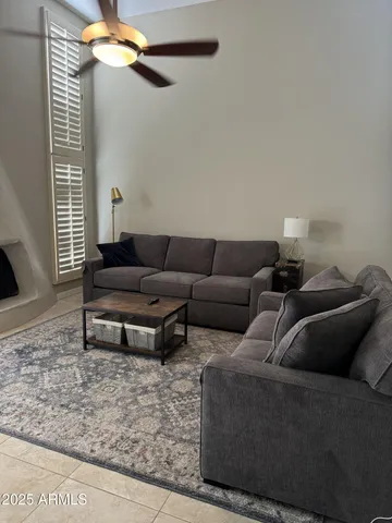 a spacious bedroom with a bed and a window