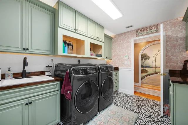 a backyard of a house with a garden and deck