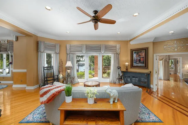 a kitchen with stainless steel appliances a dining table and chairs