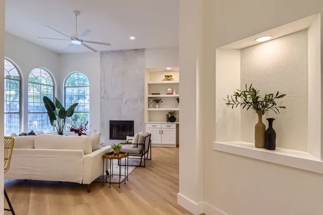 a living room with furniture and a large window