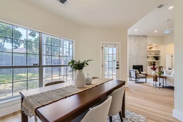 a view of a dining room with furniture window and wooden floor