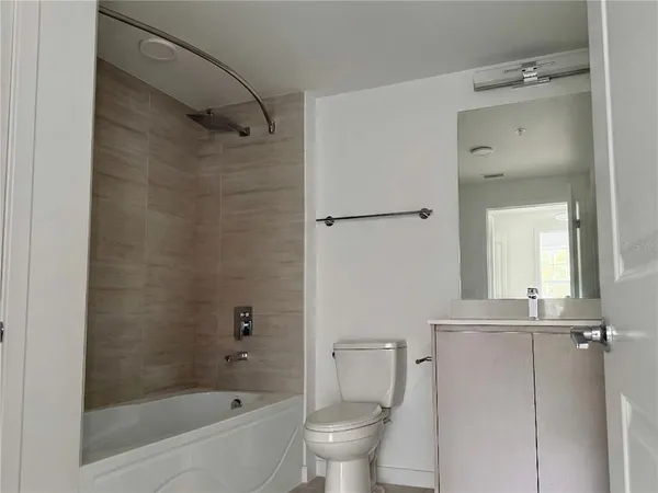 a bathroom with a bathtub and a toilet