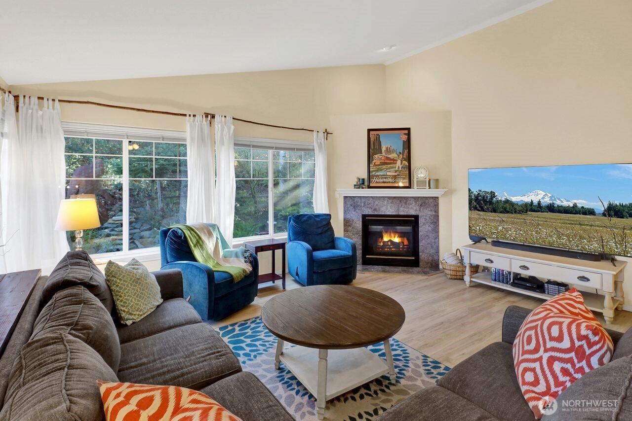 840 Nevada Street Bellingham, WA 98229 - Photo 12 of 38 a living room with furniture and a fireplace